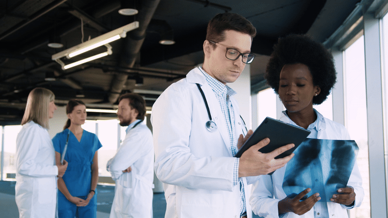 two people reviewing medical imaging together